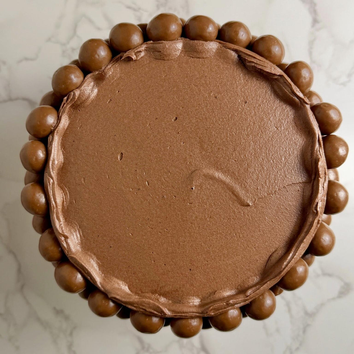 Malt chocolate cake with chocolate Swiss buttercream, close up